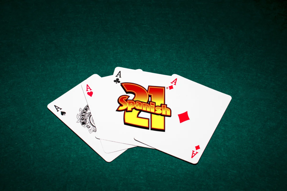 Spanish 21 blackjack logo on a dark green background with 4 ace cards